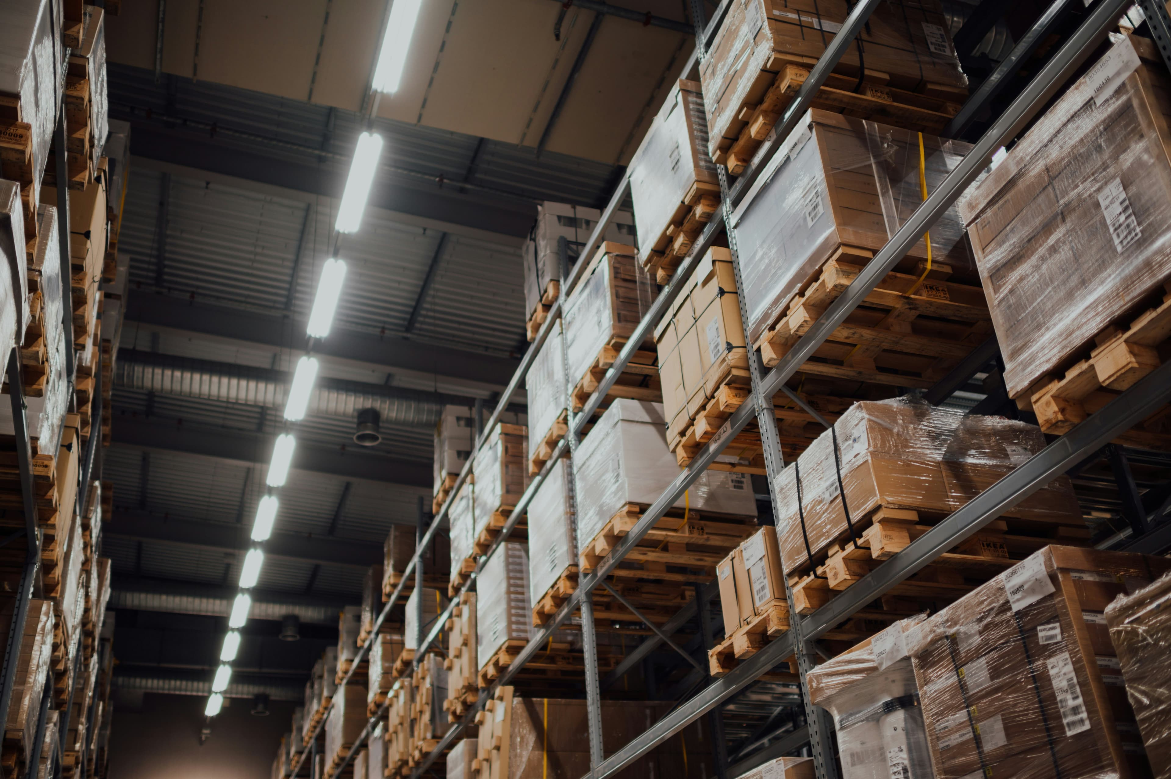 Cardboard boxes stacked on warehouse shelving