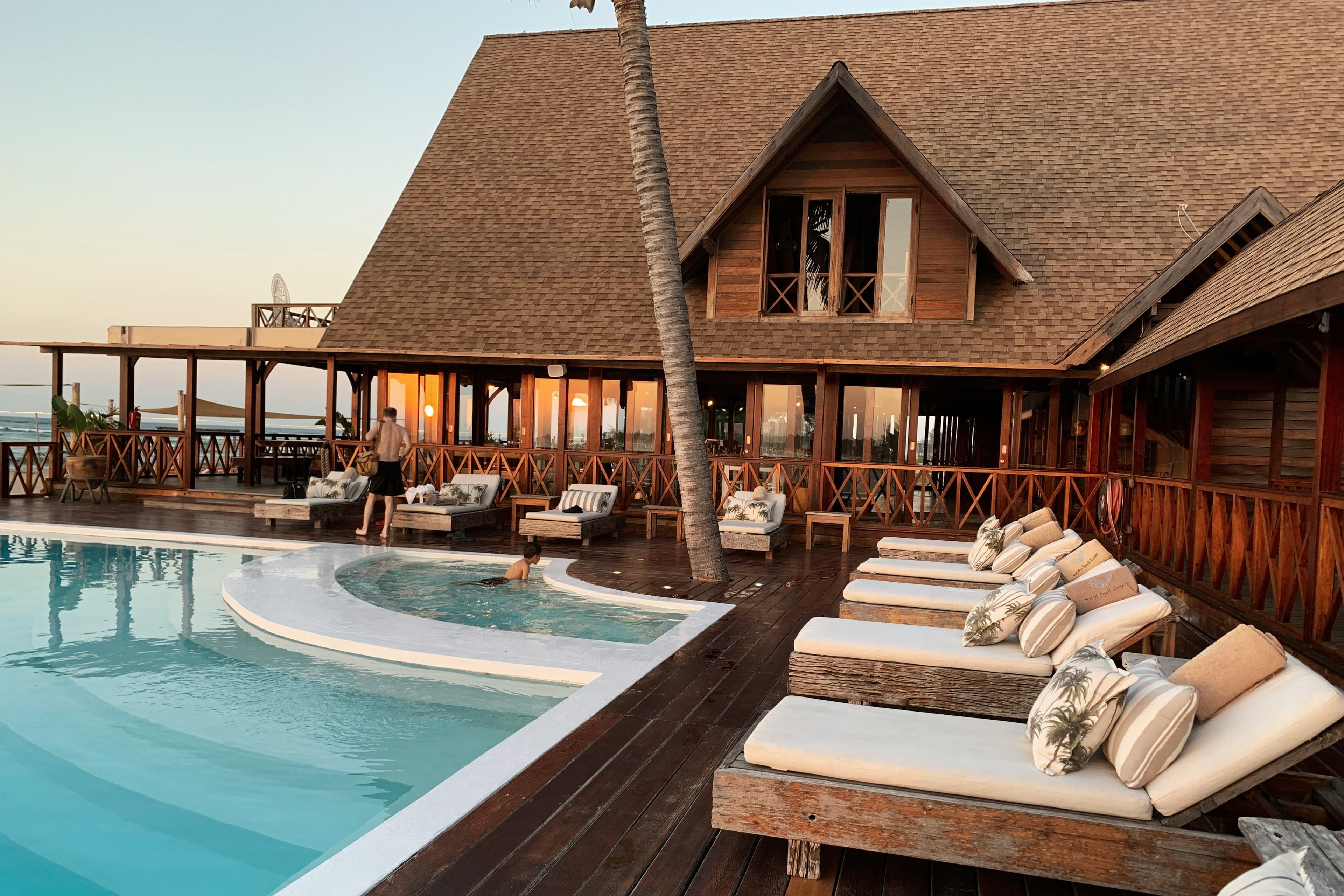 Guest relaxing in a hotel swimming pool